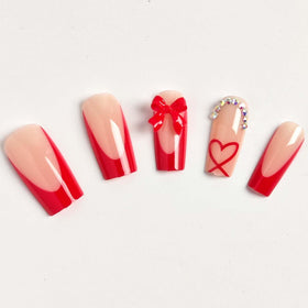 Close-up of CTTHNBD red French tip press on nails