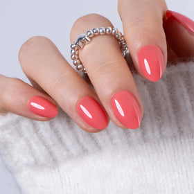 Close-up of CurvLife Extra Short Almond Press On Nails showing glossy finish