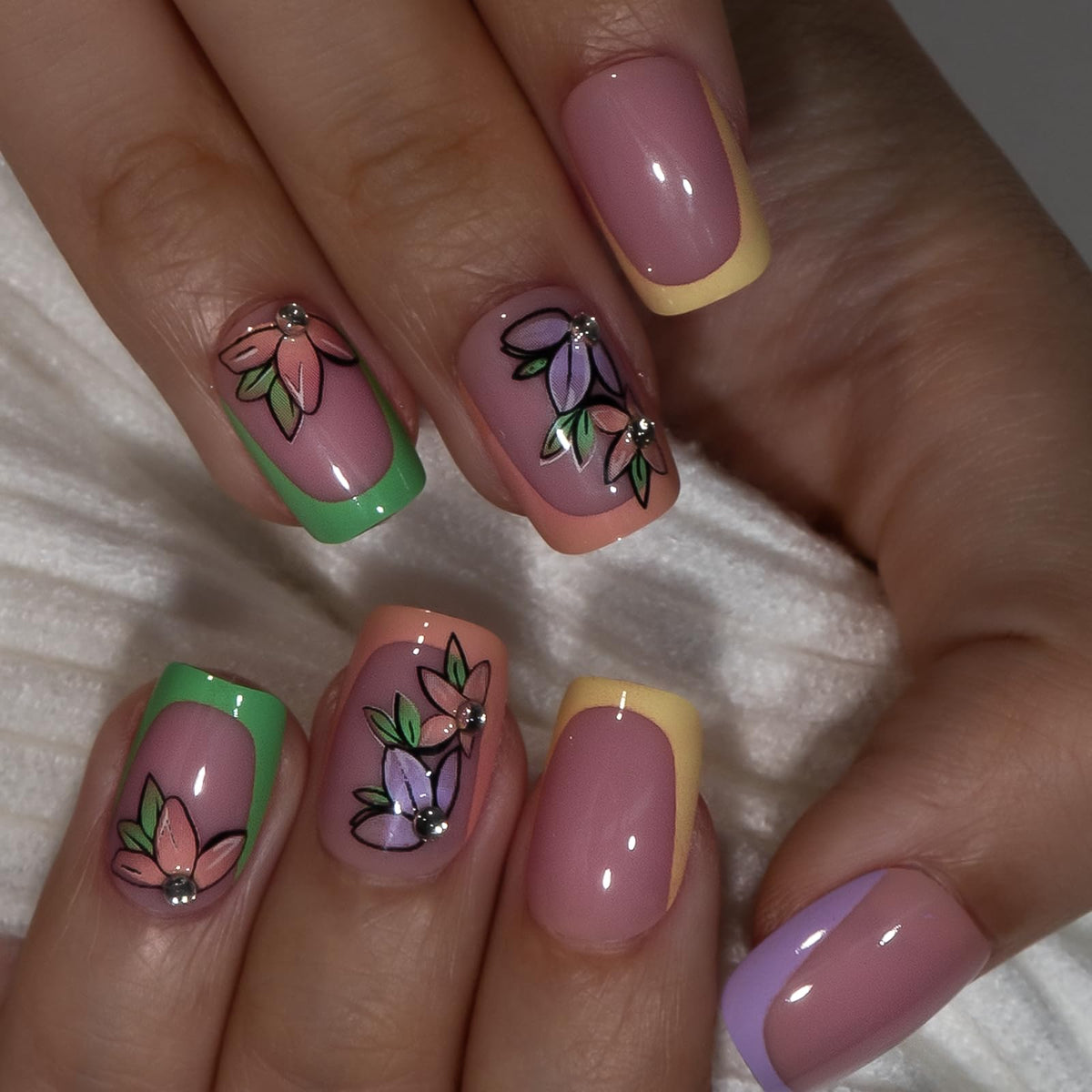Close-up of CurvLife Rainbow Bloom Pink press on nails