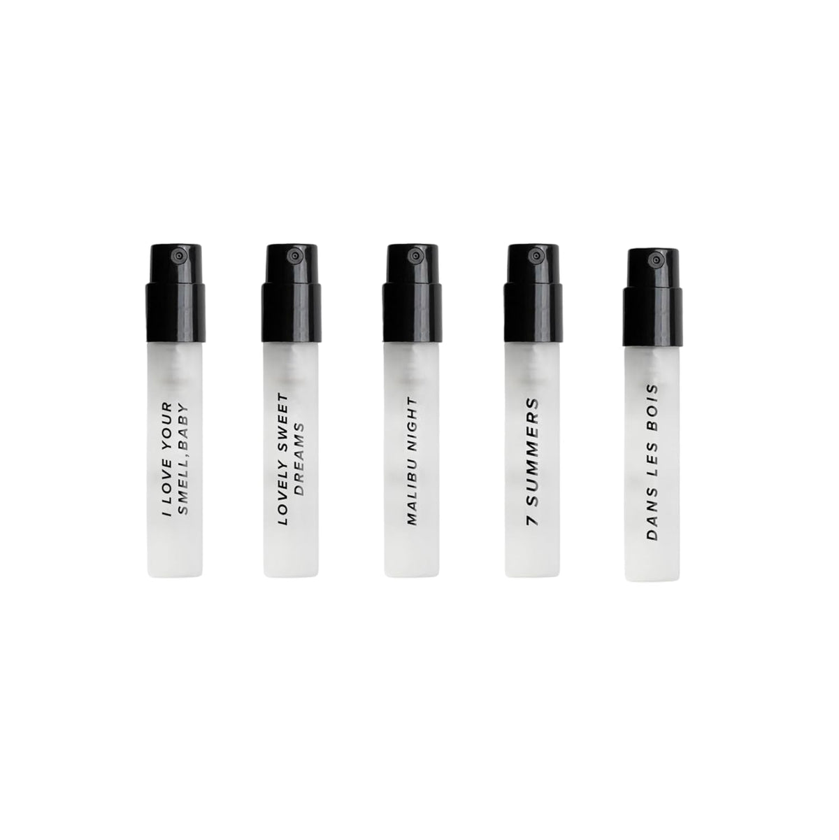 Close-up of DIME travel size perfume bottles in the sampler kit