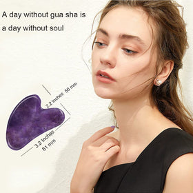 Close-up of Ditind Gua Sha tool showing jade texture