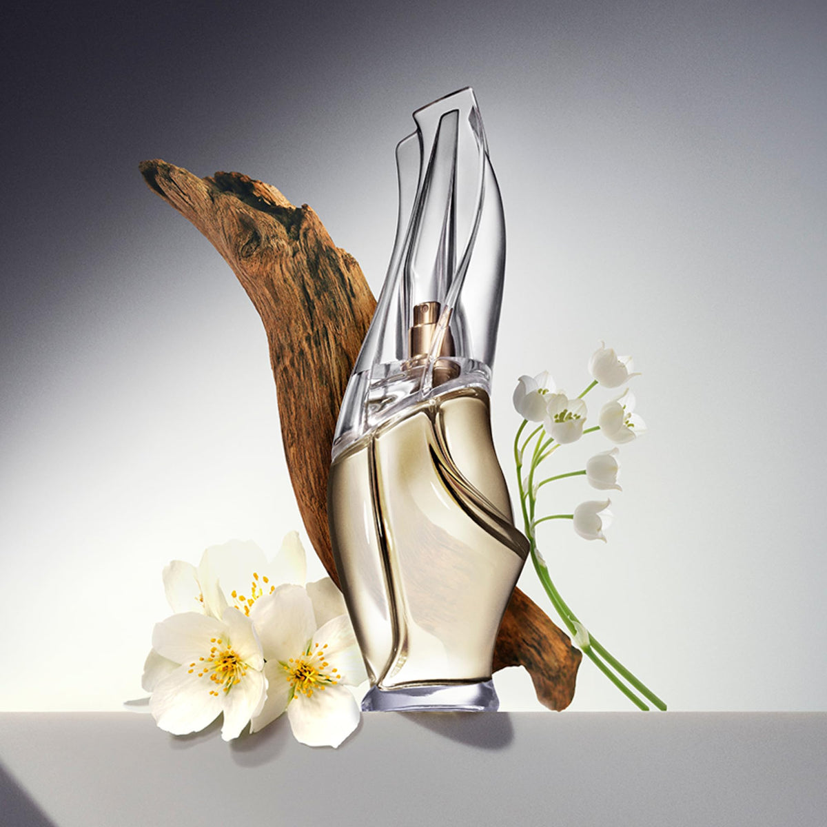 Close-up of Donna Karan Cashmere Mist Mini Eau de Toilette spray bottle