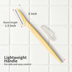 Close-up of DORCO Tinkle razor with stainless steel blade
