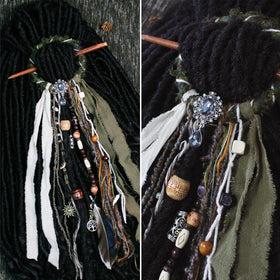 Close-up of dreadlock hair tie with fabric and metal accessories