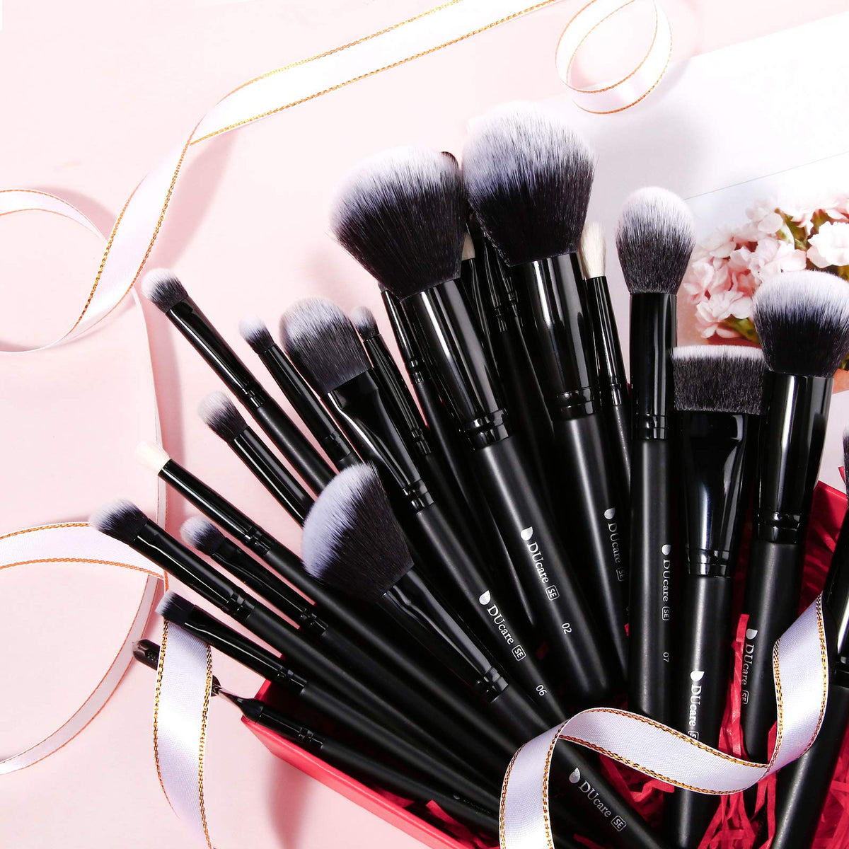 Close-up of DUcare makeup brushes showing synthetic fibres