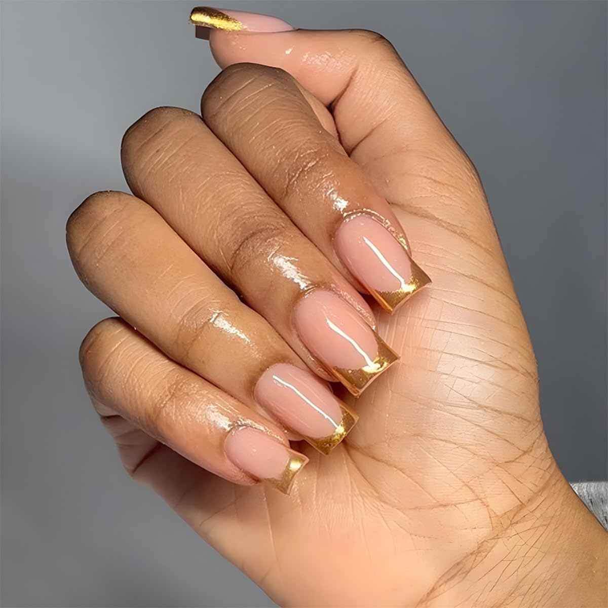 Close-up of DZPGUONIZ medium square press-on nails in nude pink glitter