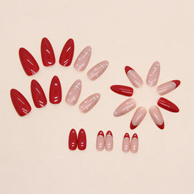 Close-up of FJSMTOPl almond fake nails in red colour