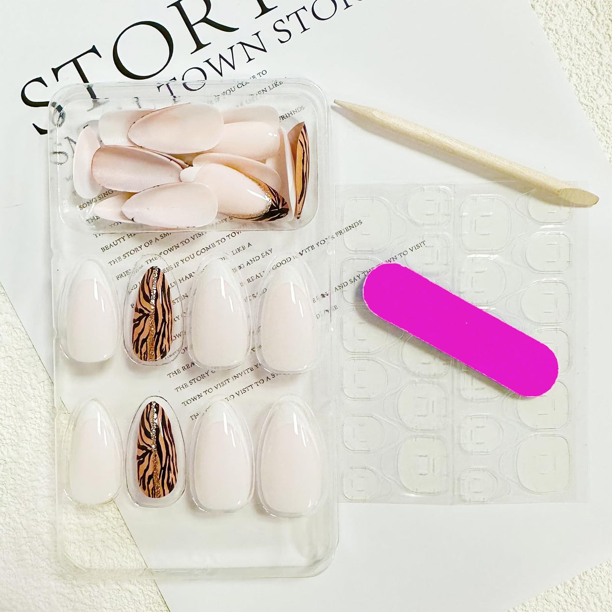 Close-up of FJSMTOPl almond press on nails with white French tip