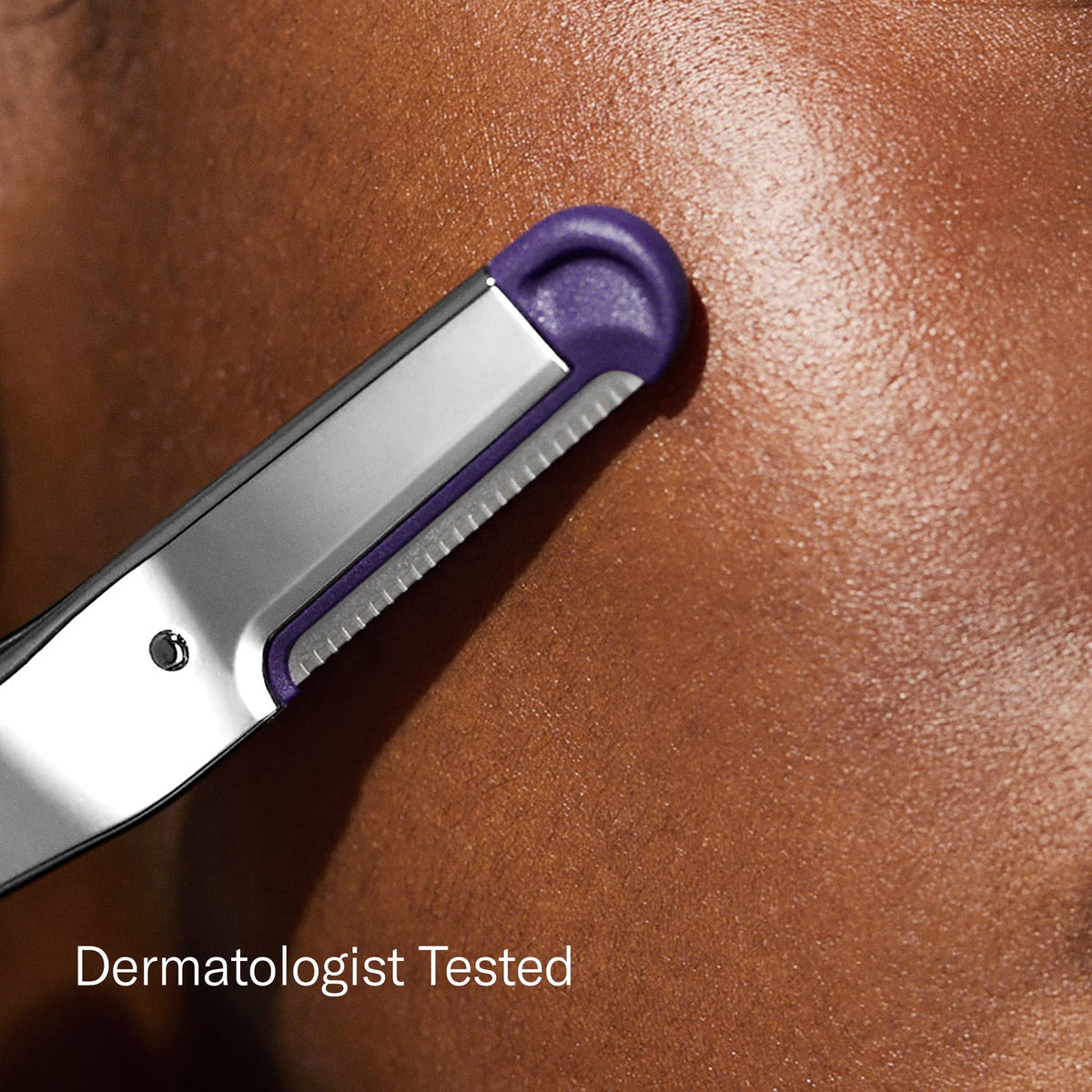 Close-up of Flamingo Dermaplane Blade with pull tab