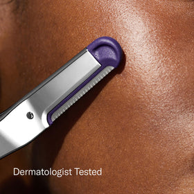 Close-up of Flamingo Dermaplane Blade with pull tab