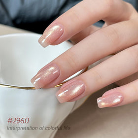 Close-up of GAOY Glitter Cat Eye Gel Nail Polish in Gold Brown