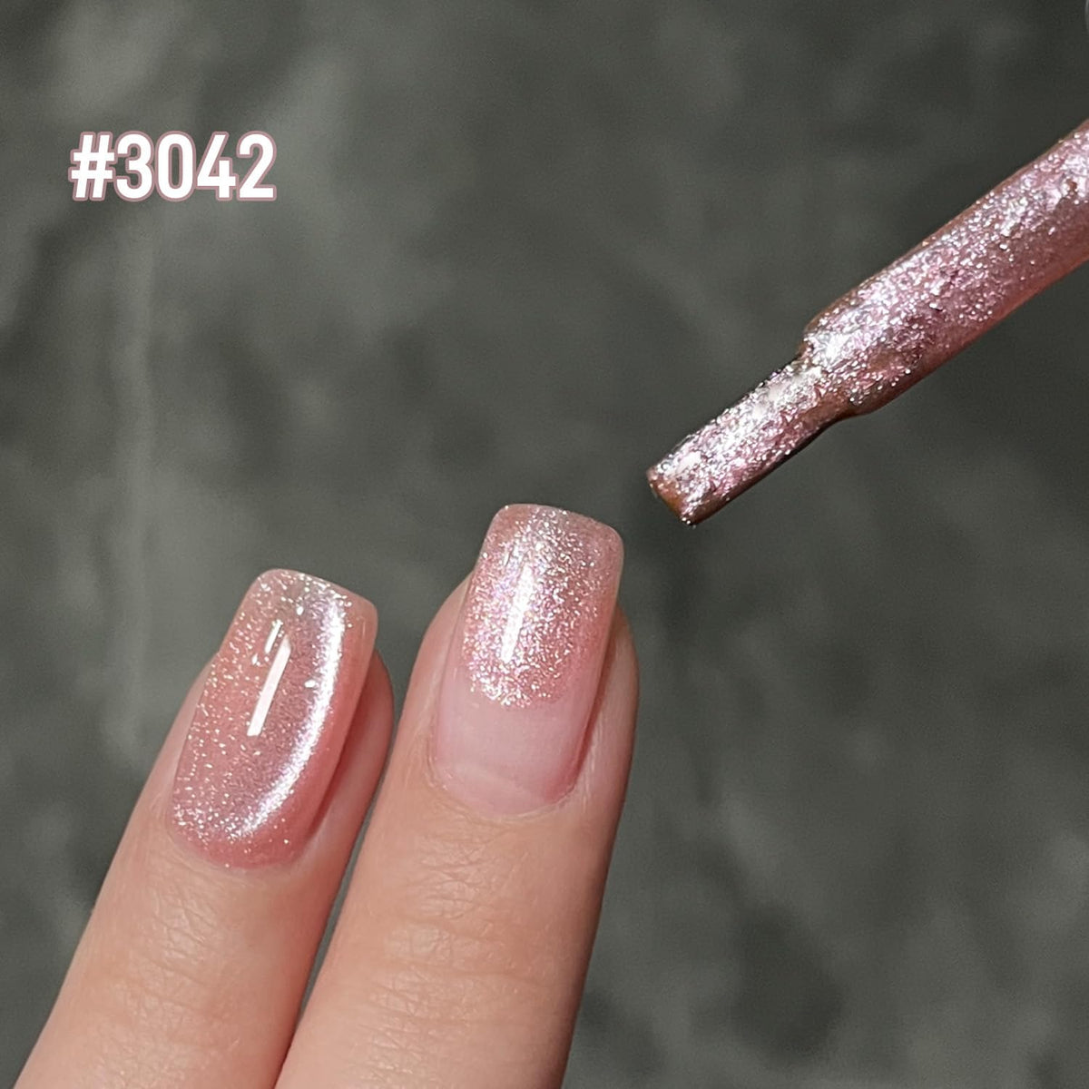 Close-up of GAOY Jelly Pink Cat Eye Gel Nail Polish applied on nails