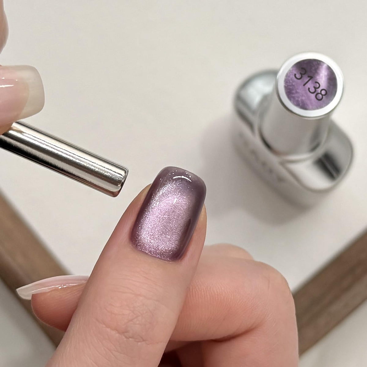 Close-up of GAOY Jelly Purple Cat Eye Gel Nail Polish applied on nails