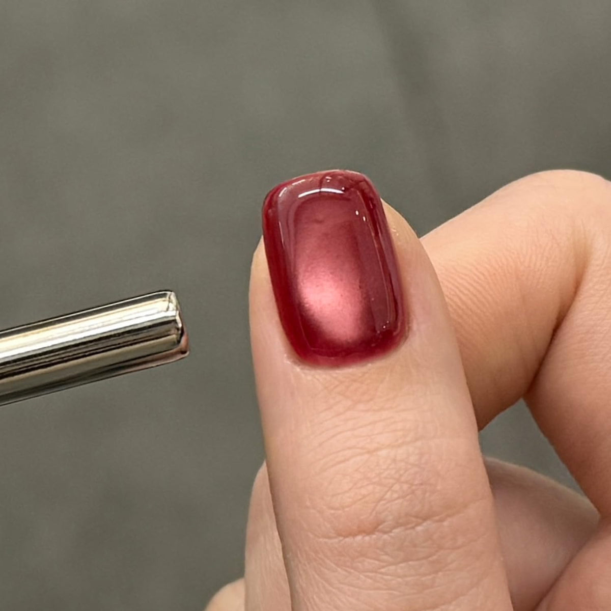 Close-up of GAOY Jelly Red Cat Eye Gel Nail Polish texture