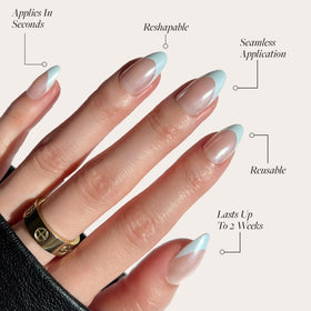 Close-up of Glamnetic short almond nails with baby blue French tips