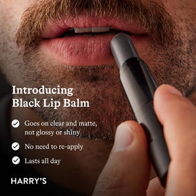 Close-up of Harry's Black Lip Balm with meadowfoam oil