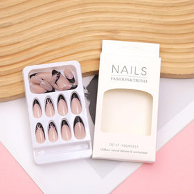 Close-up of HPYFOI press on nails with bow design