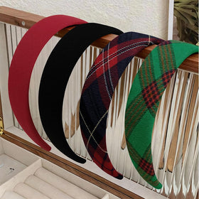 Close-up of Huachi red plaid headband on a white background