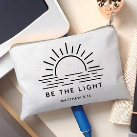 Close-up of HubbgDesign Be The Light makeup bag zipper and fabric