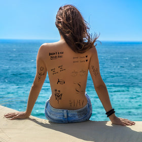 Close-up of inspirational quotes temporary tattoos