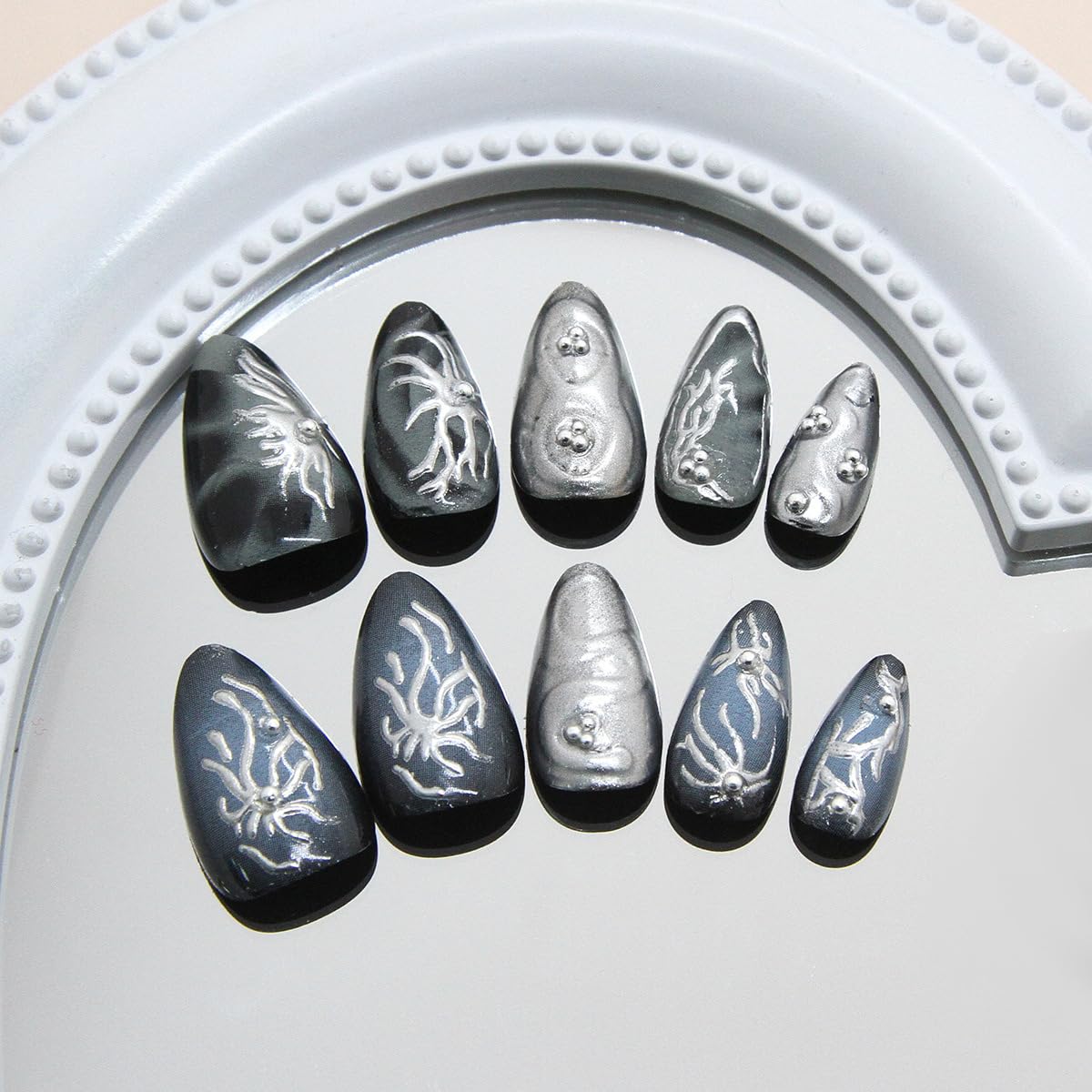 Close-up of KRTBKR Goth Press On Nails showing glitter detail