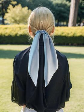 Close-up of LFOUVRE knotted bow hair scrunchie in blue