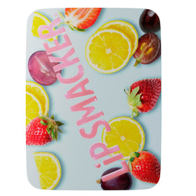 Close-up of Lip Smacker Strawberry flavour lip balm in the trio tin