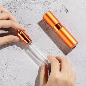 Close-up of LISAPACK perfume bottle sprayer mechanism