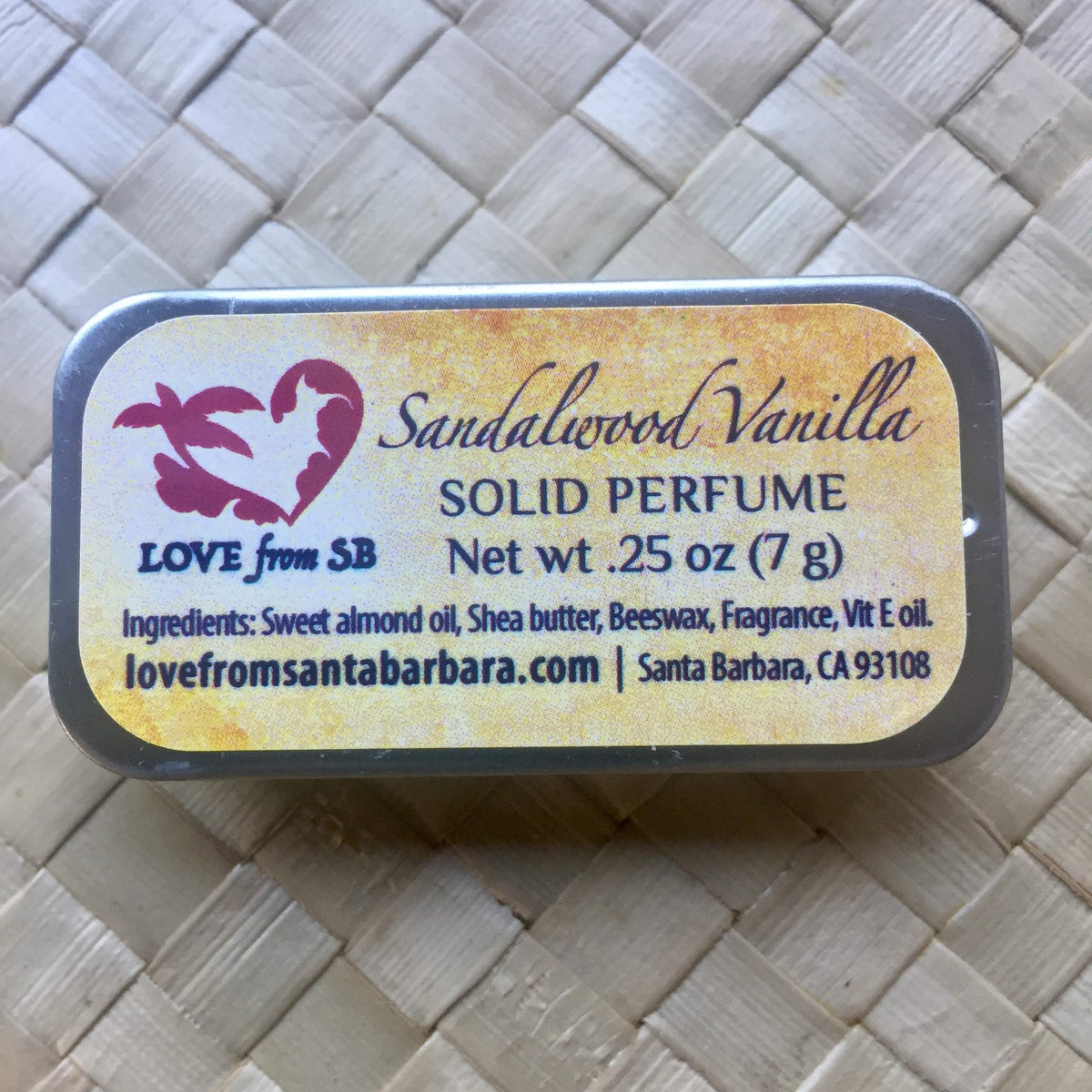 Close-up of Love from Santa Barbara Sandalwood Vanilla Solid Perfume compact