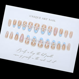 Close-up of LPOODDNU Almond Press On Nails design