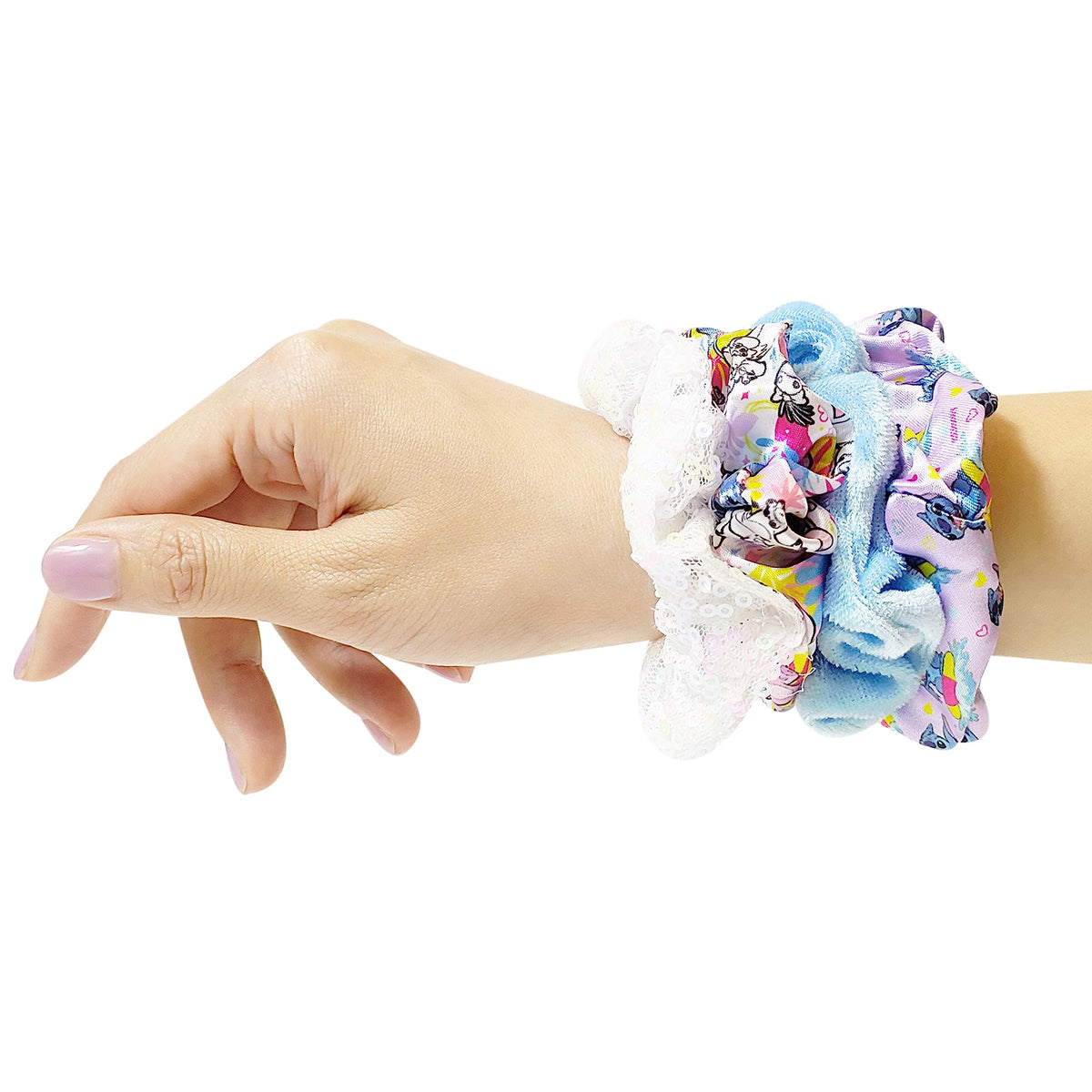 Close-up of LUV HER scrunchies displaying their soft silk feel
