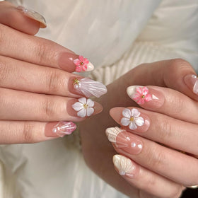 Close-up of MAGLFELL press on nails with floral pattern