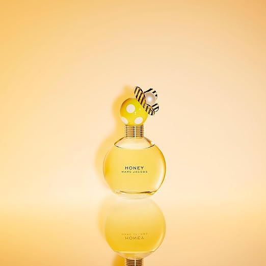 Close-up of Marc Jacobs Honey Eau de Parfum bottle showing butterfly details