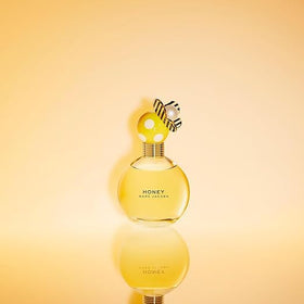 Close-up of Marc Jacobs Honey Eau de Parfum bottle showing butterfly details