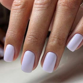 Close-up of Modelones press on nails with jelly adhesive tabs and nail glue
