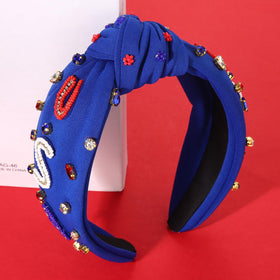 Close-up of MOLOCH patriotic headband showing rhinestone embellishments