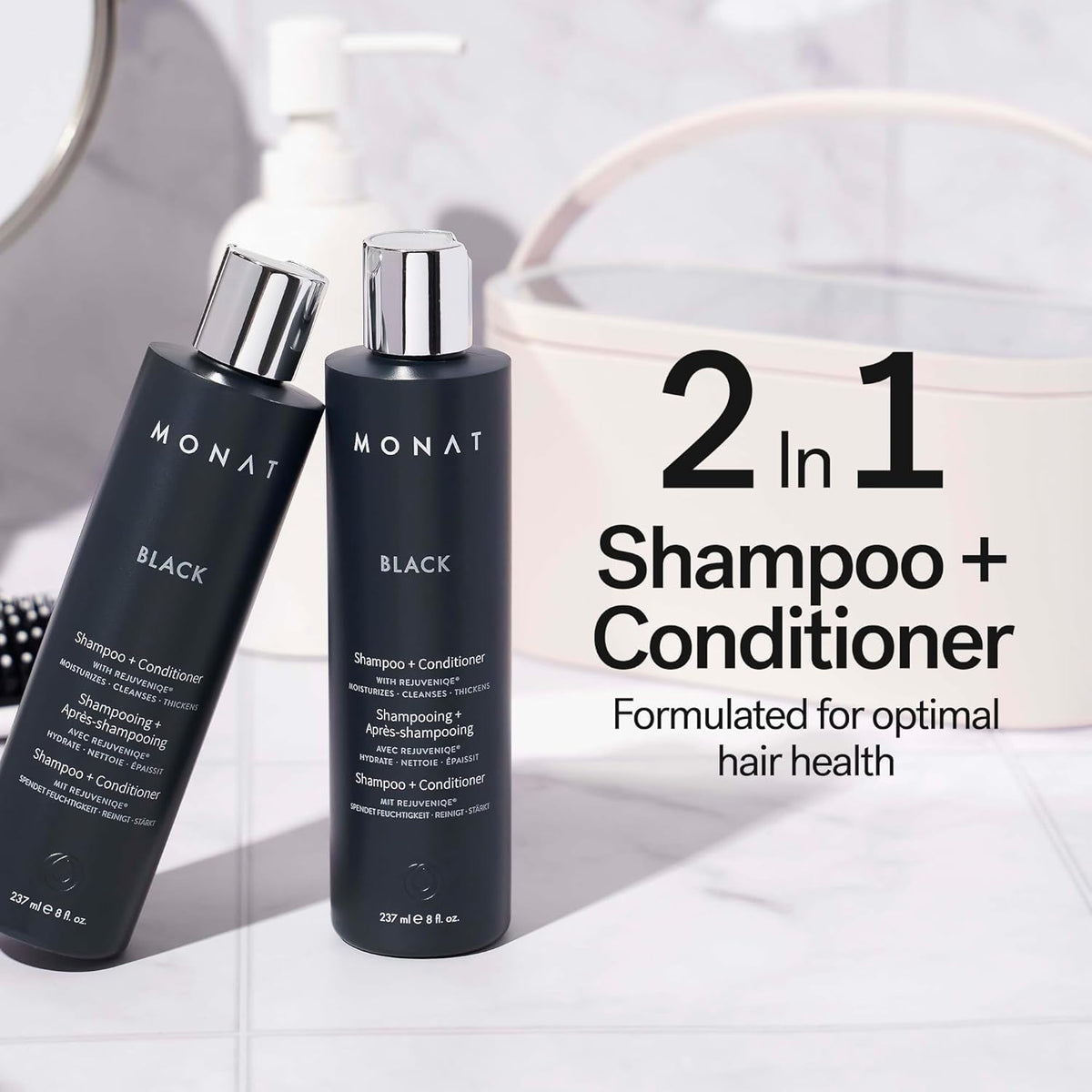 Close-up of MONAT Black Shampoo + Conditioner bottle