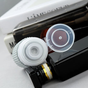 Close-up of Mrsdry 6oz travel bottle with no-drip valve