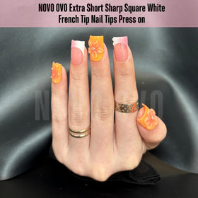 Close-up of NOVO OVO nail tips showing thickness and cuticle end