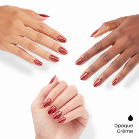 Close-up of OPI On Point Big Candy Apple Red nails with glitter