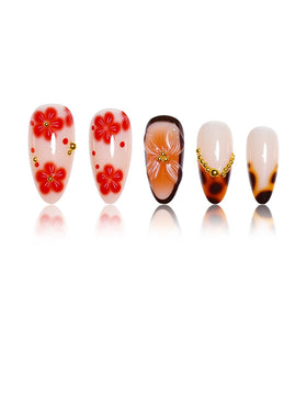 Close-up of SEENEEY press on nails with gold charm