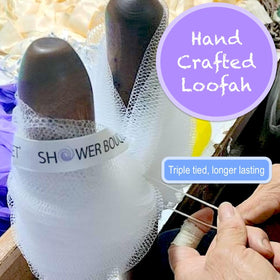 Close-up of Shower Bouquet soft mesh loofah with triple-tied knot