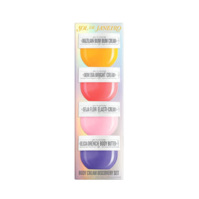 Close-up of Sol de Janeiro Body Boldly Body Creams with floral background
