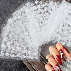 Close-up of SPLOCUDU self-adhesive nail stickers in snowman and elk designs