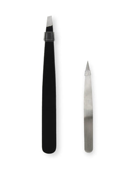 Close-up of the pointed and angled tweezers from the eyebrow grooming kit