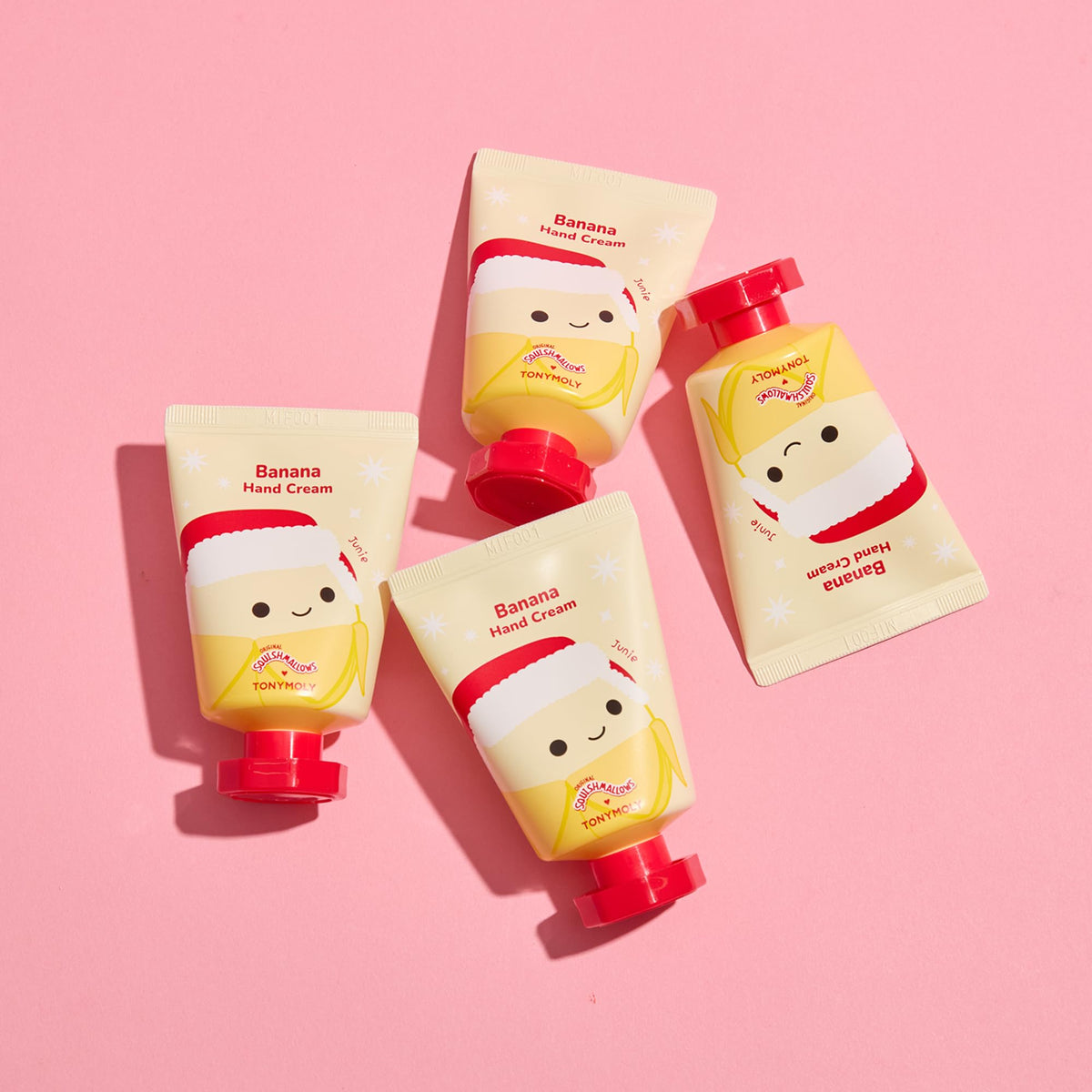 Close-up of the three TONYMOLY x Squishmallows hand creams on a festive background