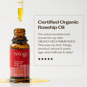 Close-up of Trilogy Rosehip Oil bottle with dropper