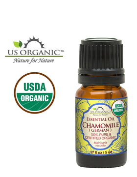 Close-up of US Organic Blue Chamomile Essential Oil bottle