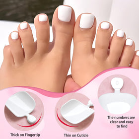Close-up of various sizes of white press on toenails