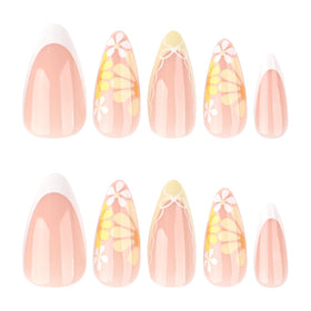 Close-up of XZMeiLun press-on nails showing French tip and floral patterns